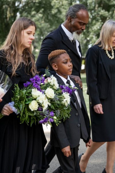 family-visiting-grave-loved-one