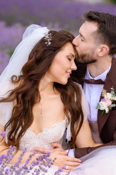 loving-newlyweds-posing-lavender-meadow-hugging