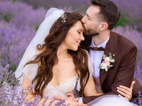 loving-newlyweds-posing-lavender-meadow-hugging loving-newlyweds-posing-lavender-meadow-hugging